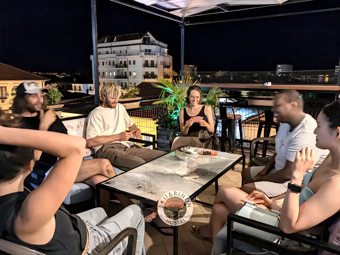 Guests enjoying the rooftop at Scodrinon Hostel